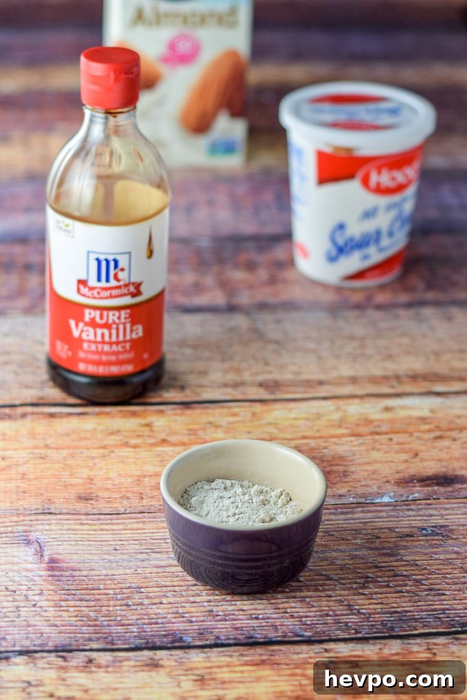 Flour, vanilla, sour cream and milk on the table