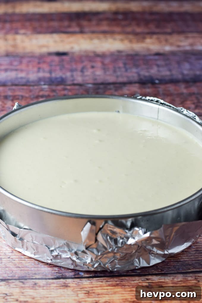 Cheesecake batter poured into the springform pan