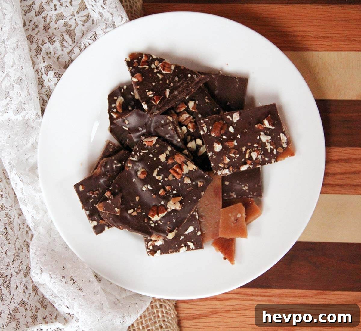 Classic Butter Toffee Recipe: Crispy Homemade Candy Guide 2 White plate with butter toffee and pecans.