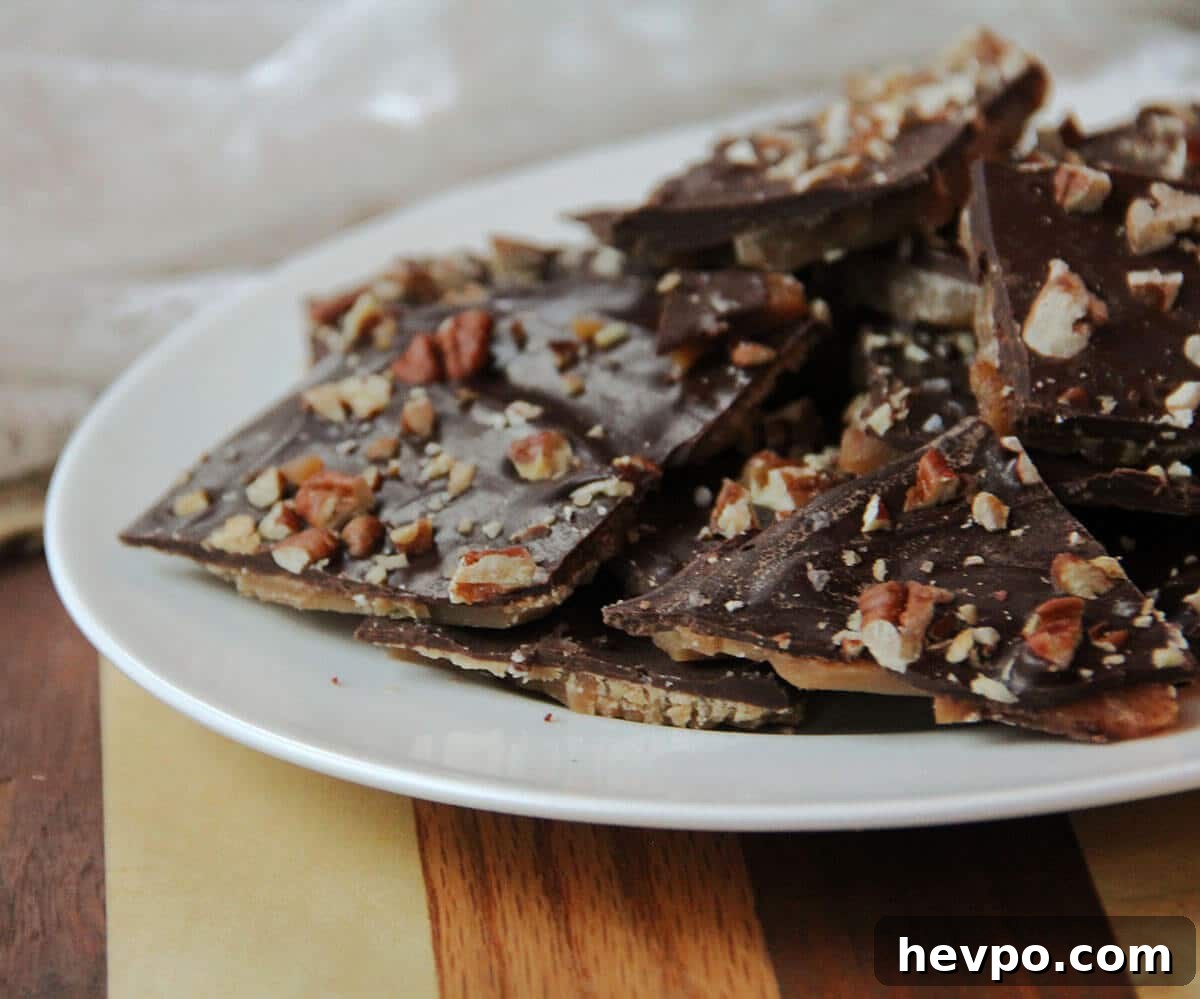 Classic Butter Toffee Recipe: Crispy Homemade Candy Guide 3 White plate of chocolate covered toffee.