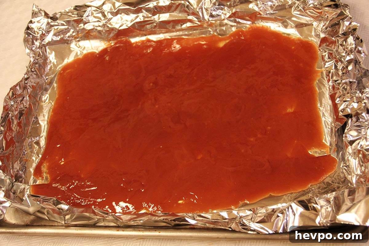 Classic Butter Toffee Recipe: Crispy Homemade Candy Guide 5 Melted butter and sugar spread in a pan.