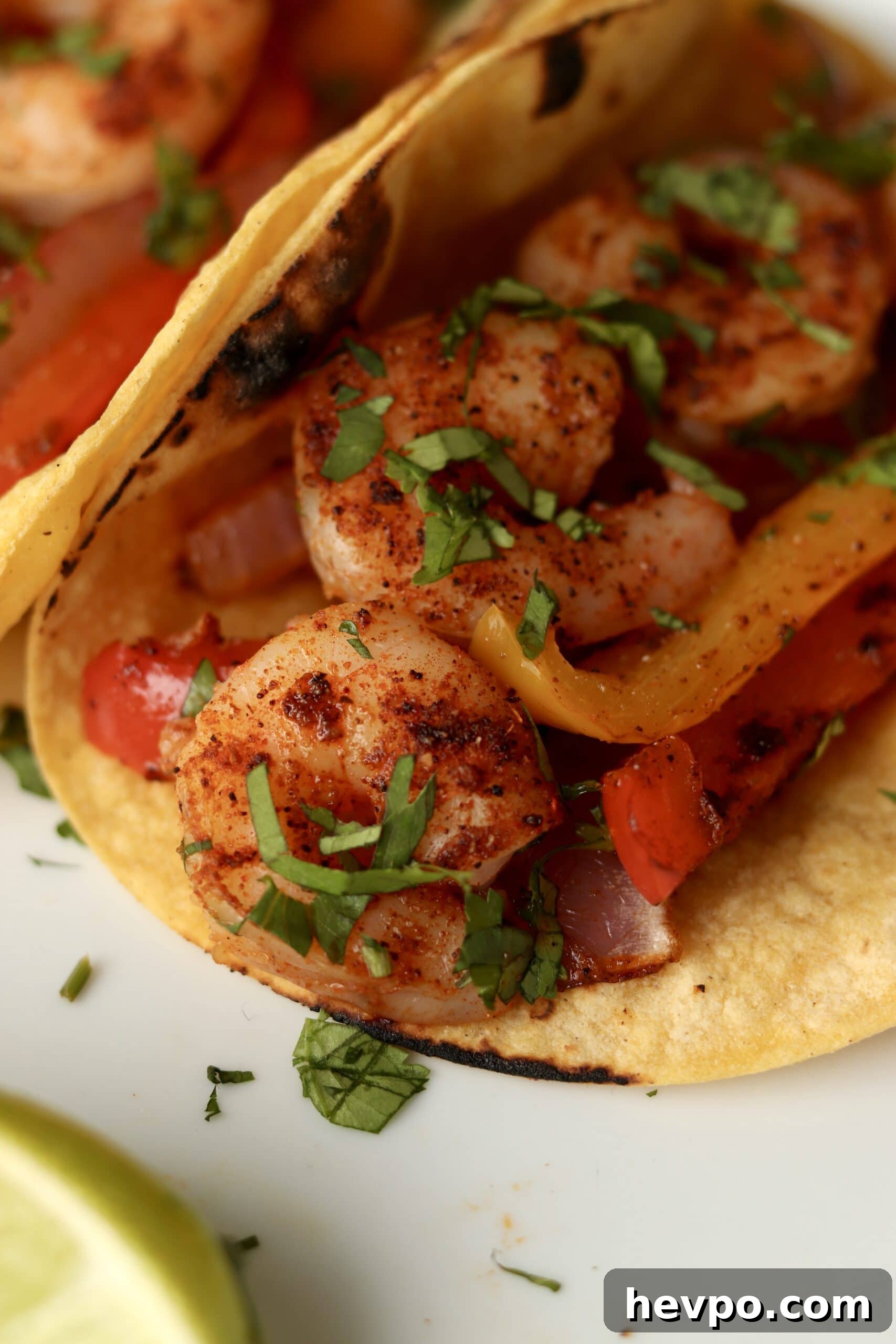 Sheet Pan Shrimp Fajitas with Peppers and Lime Butter 10 close up of sheet pan fajitas with shrimp