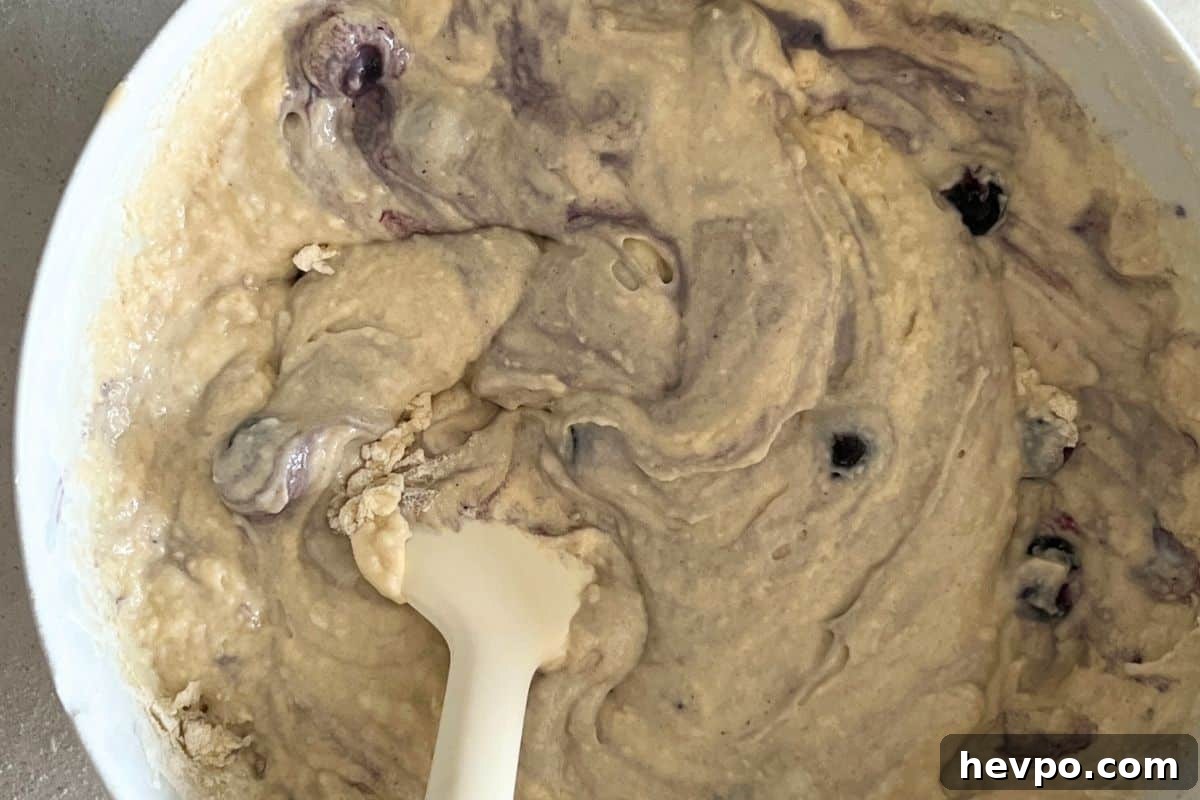 Trisha Yearwood’s Famous Blueberry Pancake Recipe 4 Wet ingredients combined with dry ingredients in a bowl.