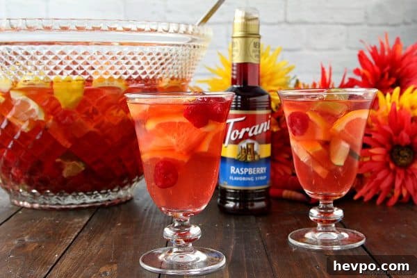 Refreshing Raspberry Sangria Punch Recipe for Parties 7 Raspberry Sangria Punch, easy white wine sangria drink recipe great for a holiday party! SnappyGourmet.com
