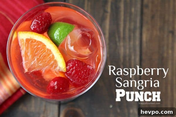 Refreshing Raspberry Sangria Punch Recipe for Parties 9 Raspberry Sangria Punch, easy white wine sangria drink recipe great for a holiday party! SnappyGourmet.com