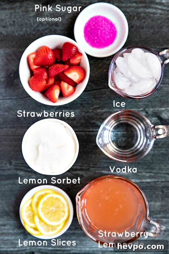 Strawberry Lemonade Vodka Cocktail Recipe for Summer Sipping 3 Ingredients to make refreshing strawberry vodka cocktail set on a dark surface