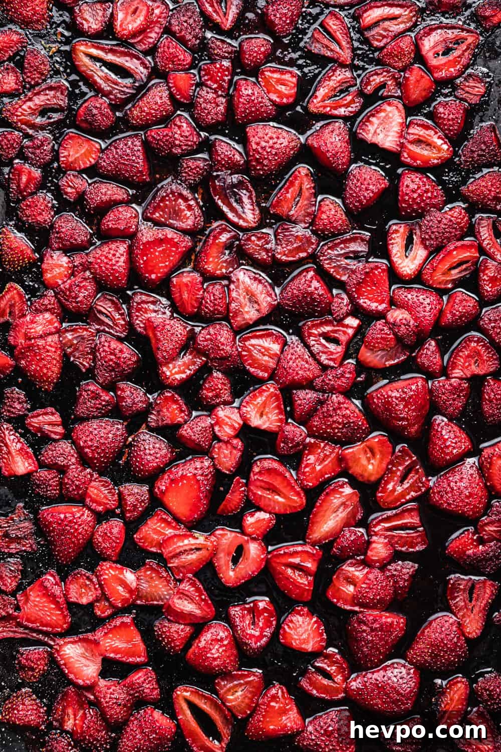 Roasted Strawberries: How to Cook and Use Them for Bold Flavor 2 roasted strawberries on a baking sheet