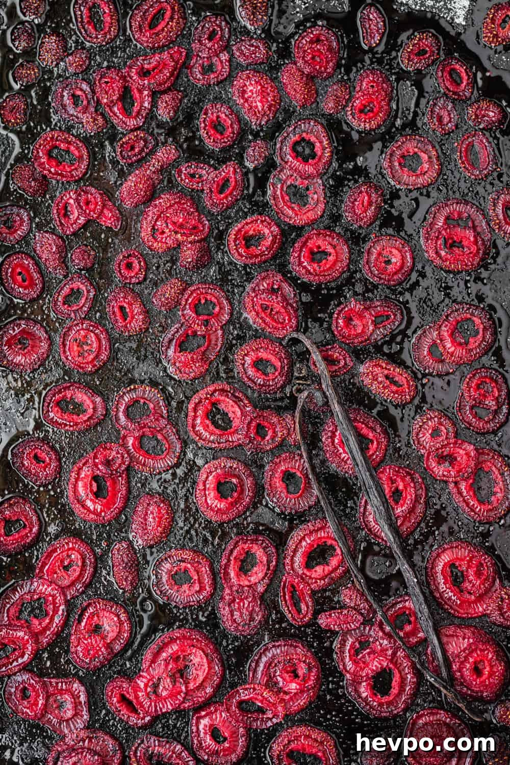 Roasted Strawberries: How to Cook and Use Them for Bold Flavor 12 Roasted Strawberries with vanilla beans on a baking sheet
