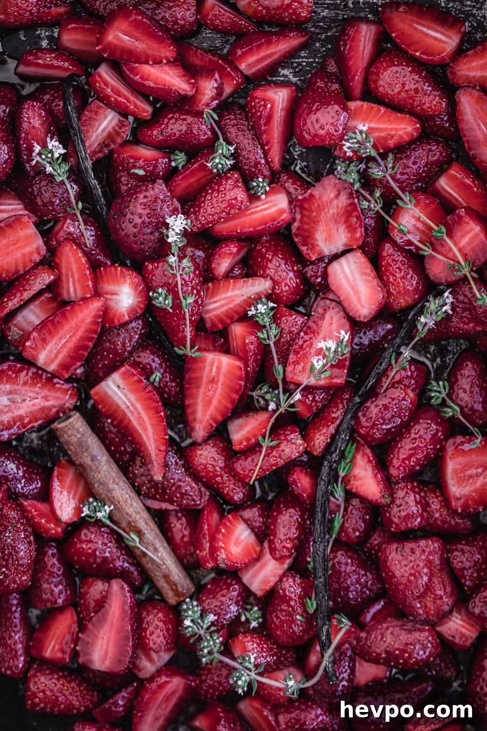 Roasted Strawberries: How to Cook and Use Them for Bold Flavor 3 strawberries with vanilla, cinnamon and thyme on a baking; pre-oven