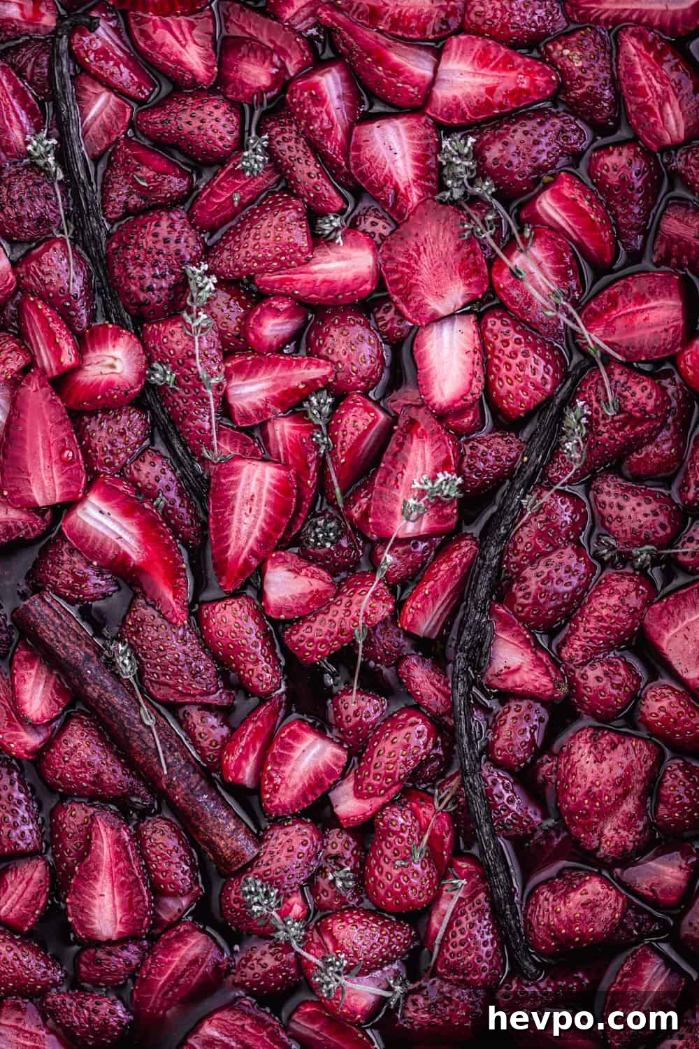 Roasted Strawberries: How to Cook and Use Them for Bold Flavor 4 roasted strawberries with vanilla, cinnamon and thyme on a baking sheet