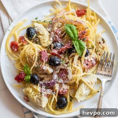 A plate of a mediterranean pasta dish.
