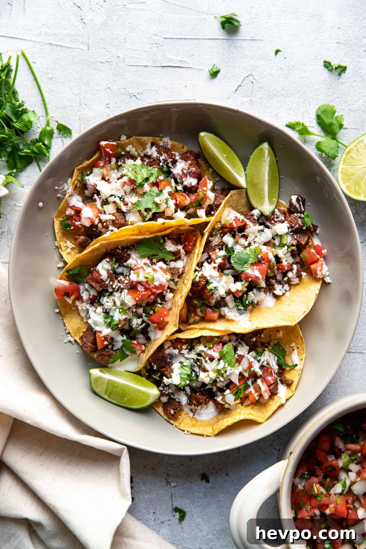 carne asada tacos on a plate.