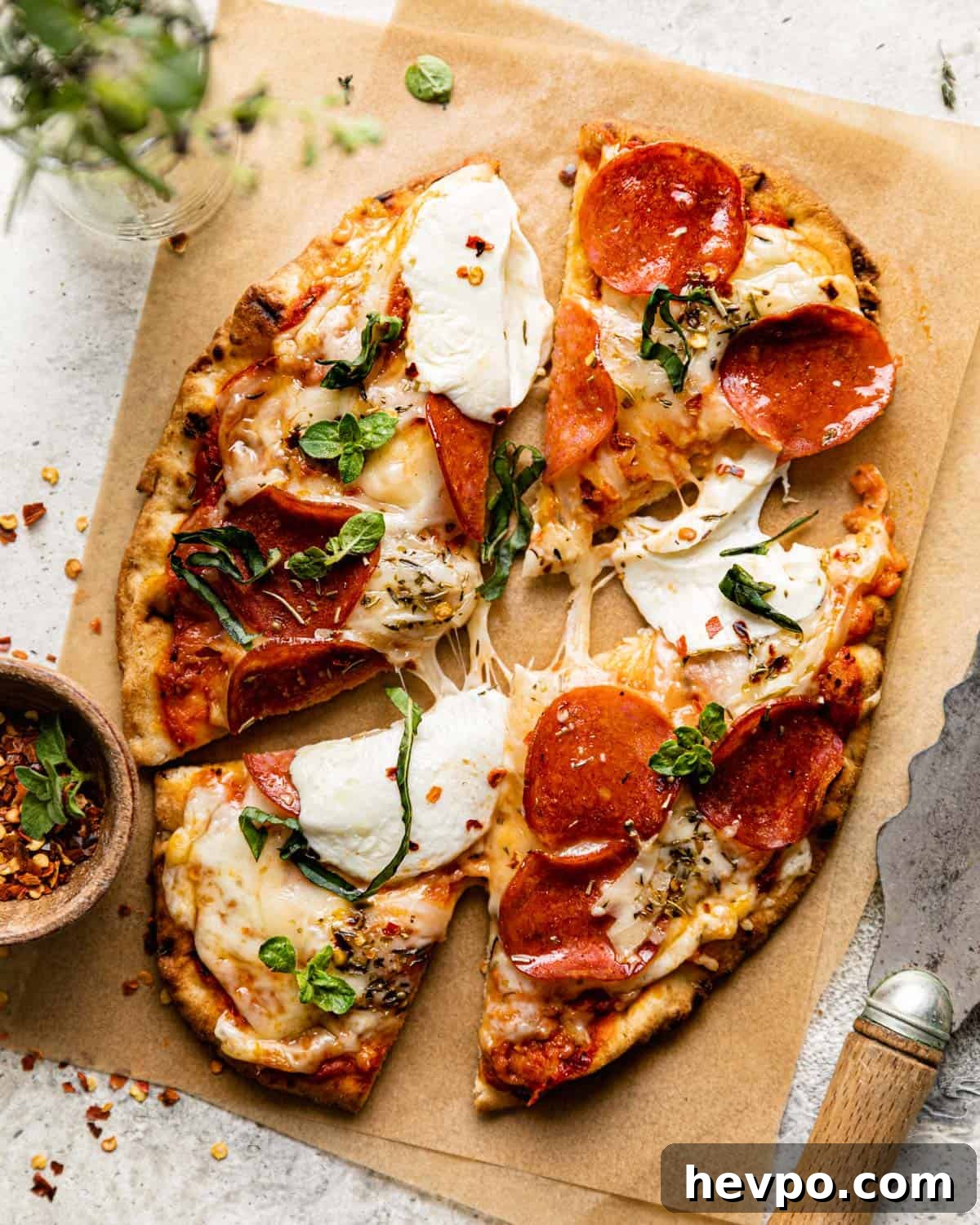 Pepperoni Naan Flatbread Pizza: Quick Homemade Recipe 2 overhead shot of pizza cut on parchment paper